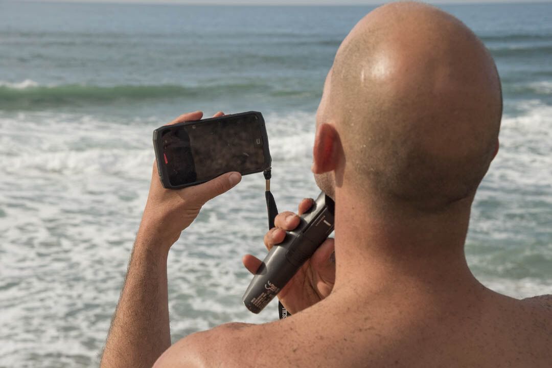 Surfer with Crosscall phone