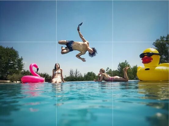 Photo framing jumping into a pool
